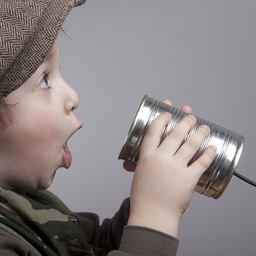 Cute Little Boy Surprised While Communicating On Tin Can Phone